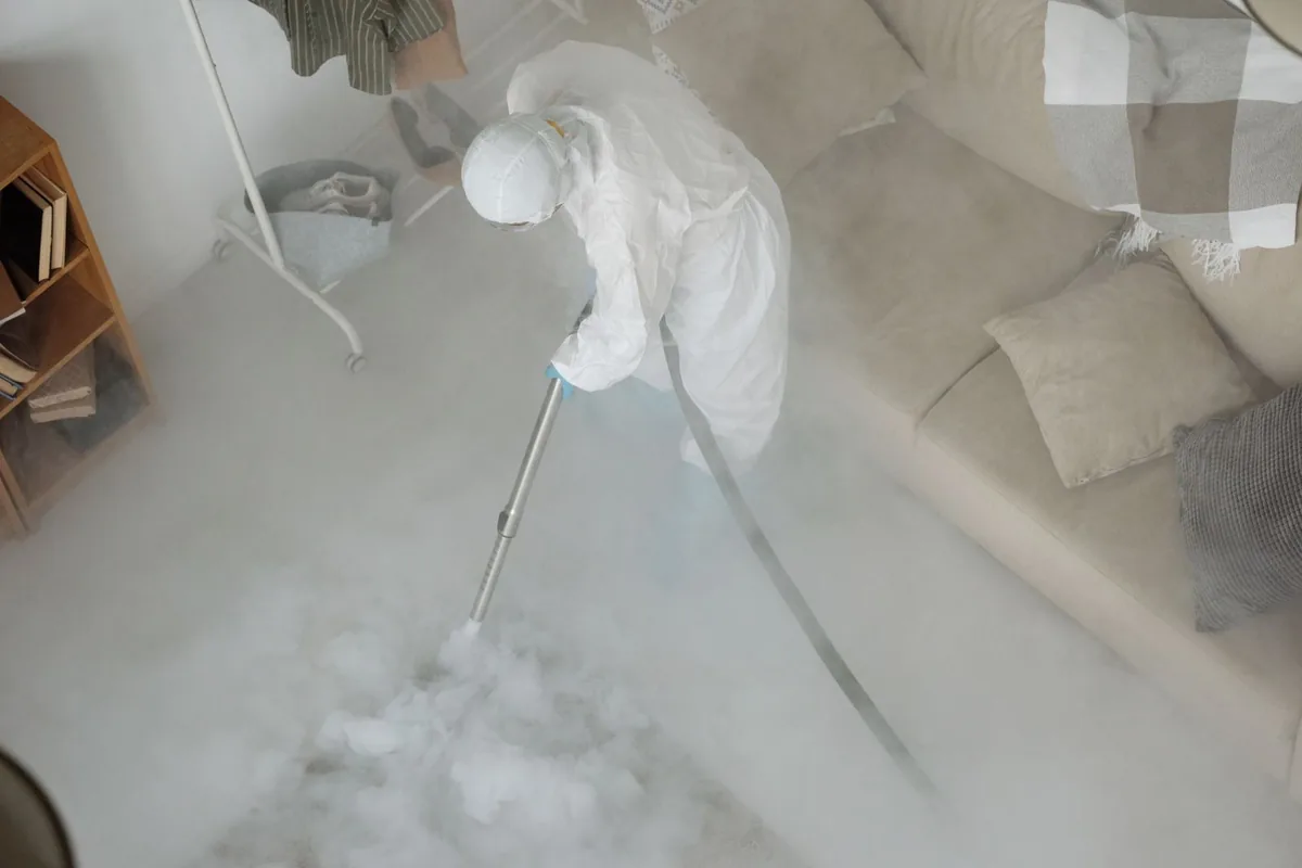 Biohazard cleanup technician in protective equipment, Independence, MN